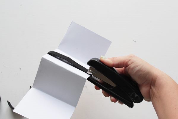 Use a stapler to secure both edges of the elastic band 